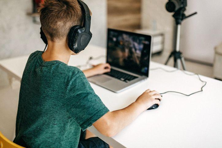 Boy with computer iStock 1165060783