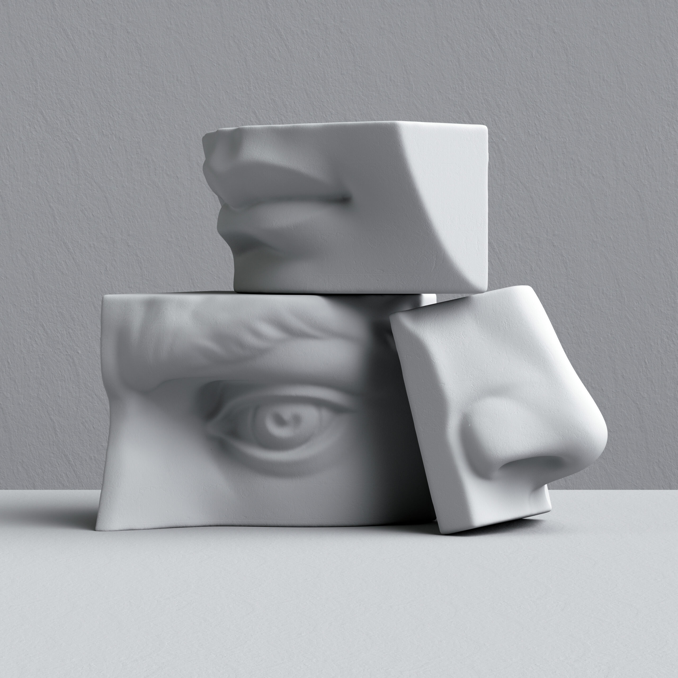 White stone sculpture of a head divided into parts