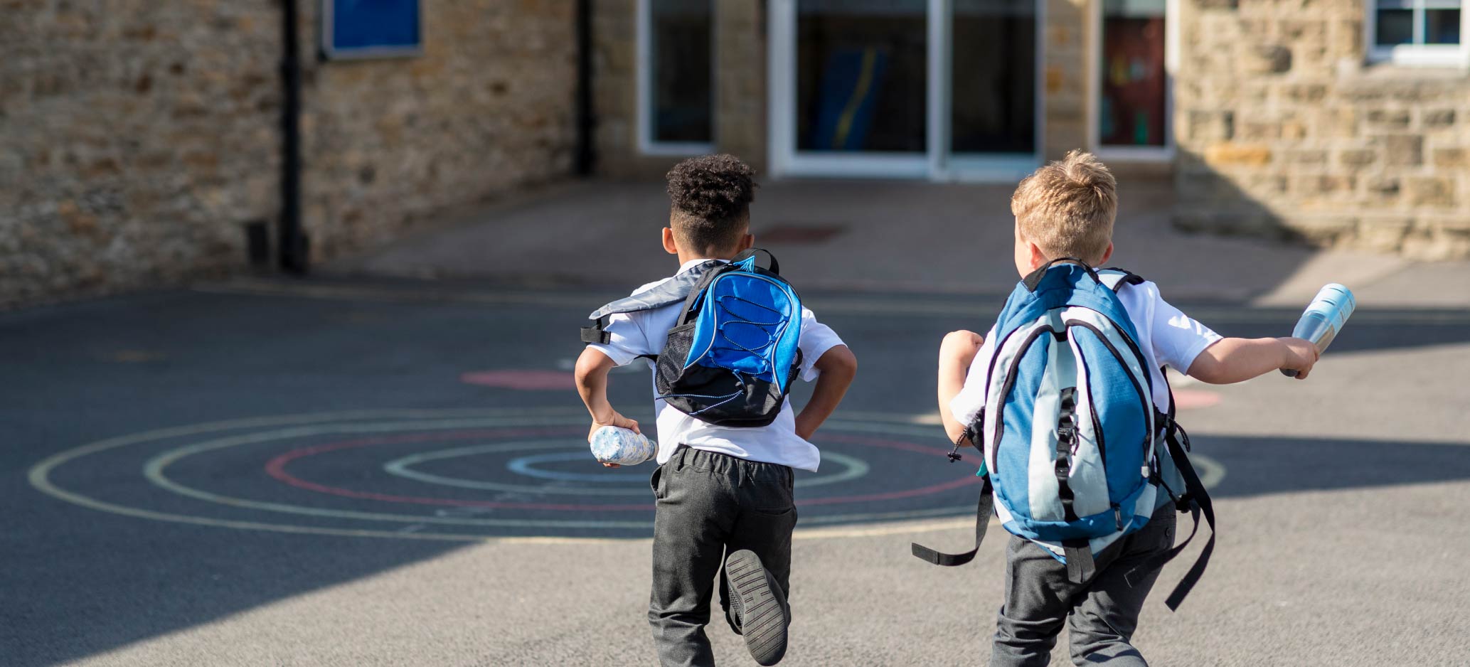 children running into school
