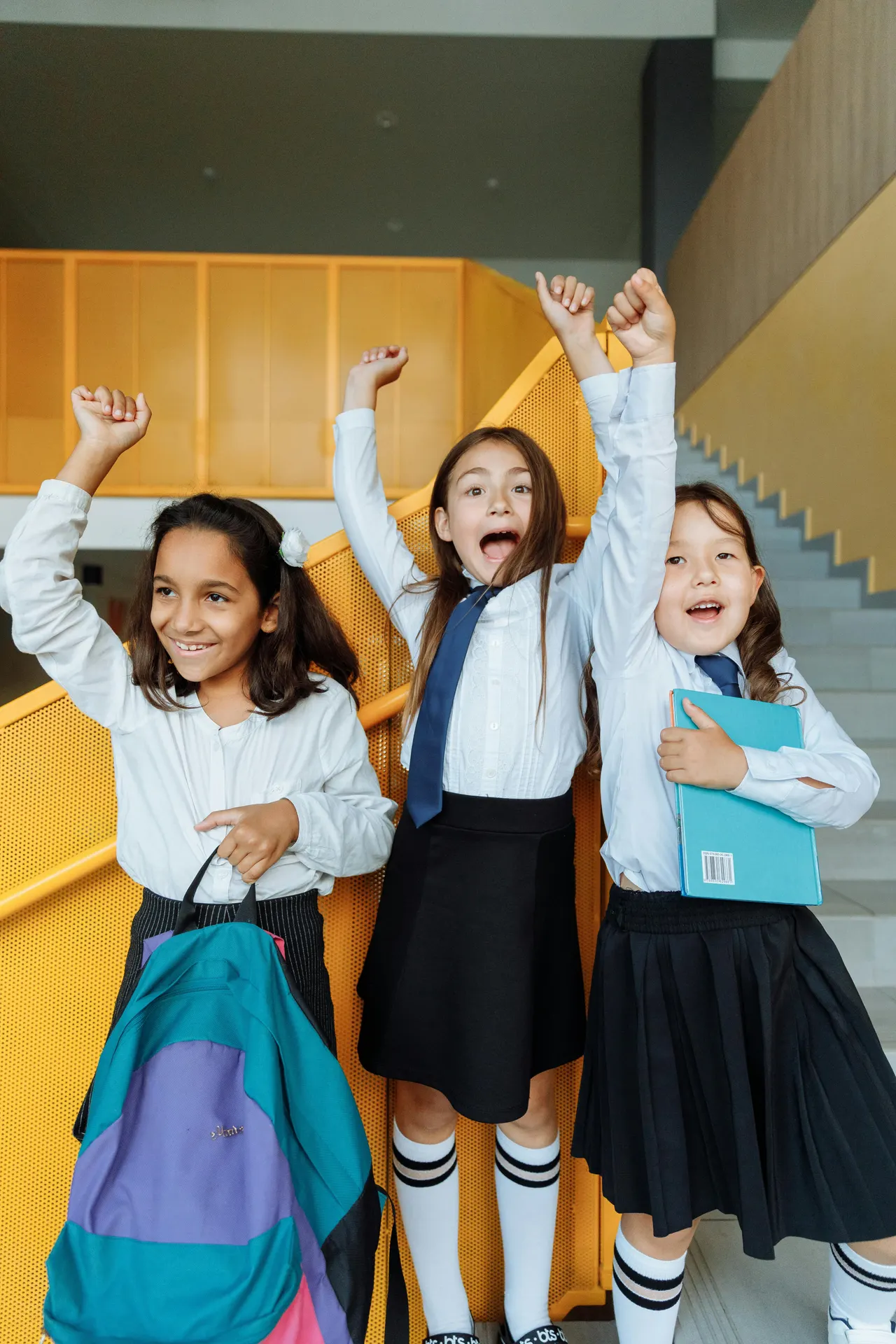 Children celebrating in a school hall