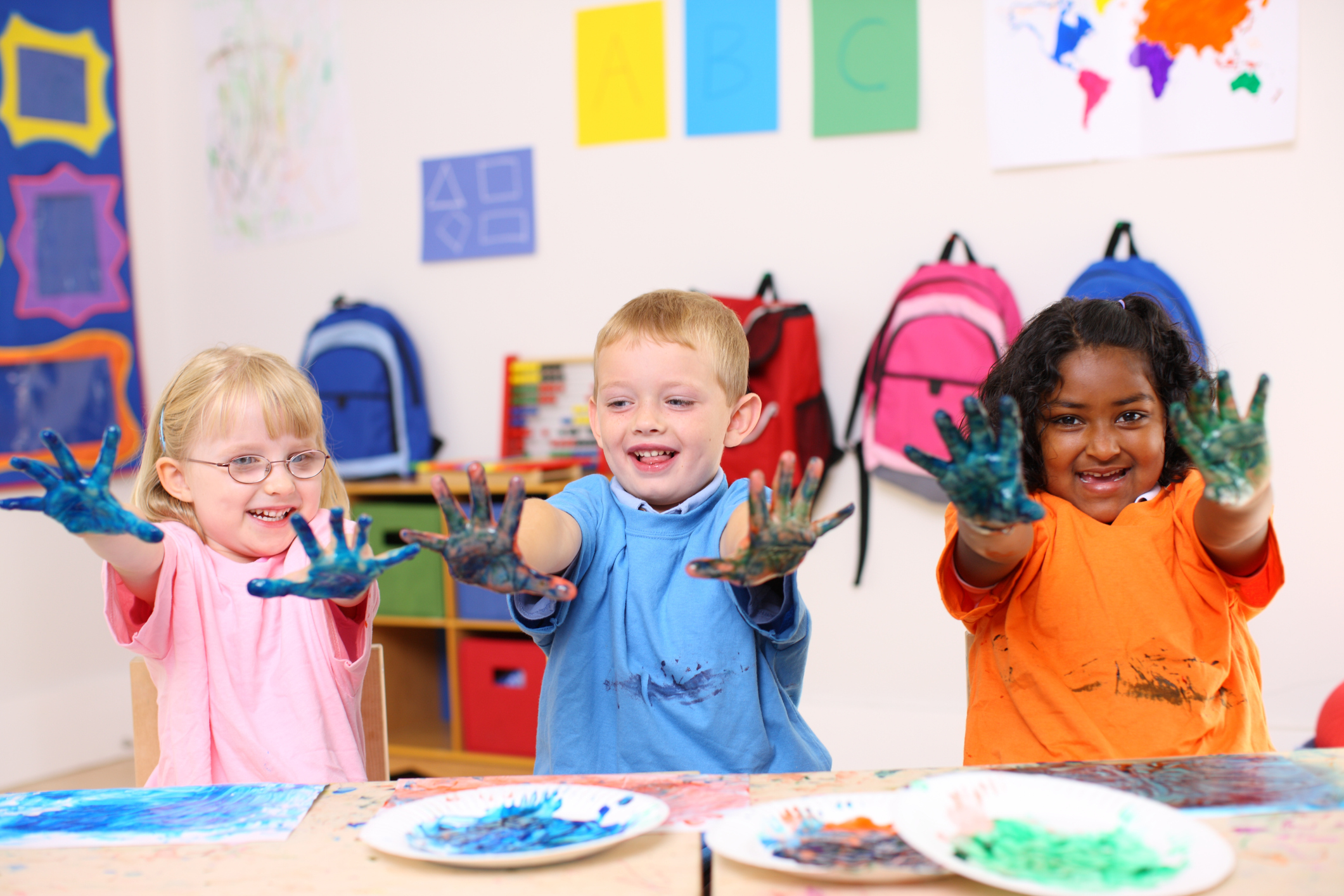 Preschoolers with painted handsiStock 118245392 1