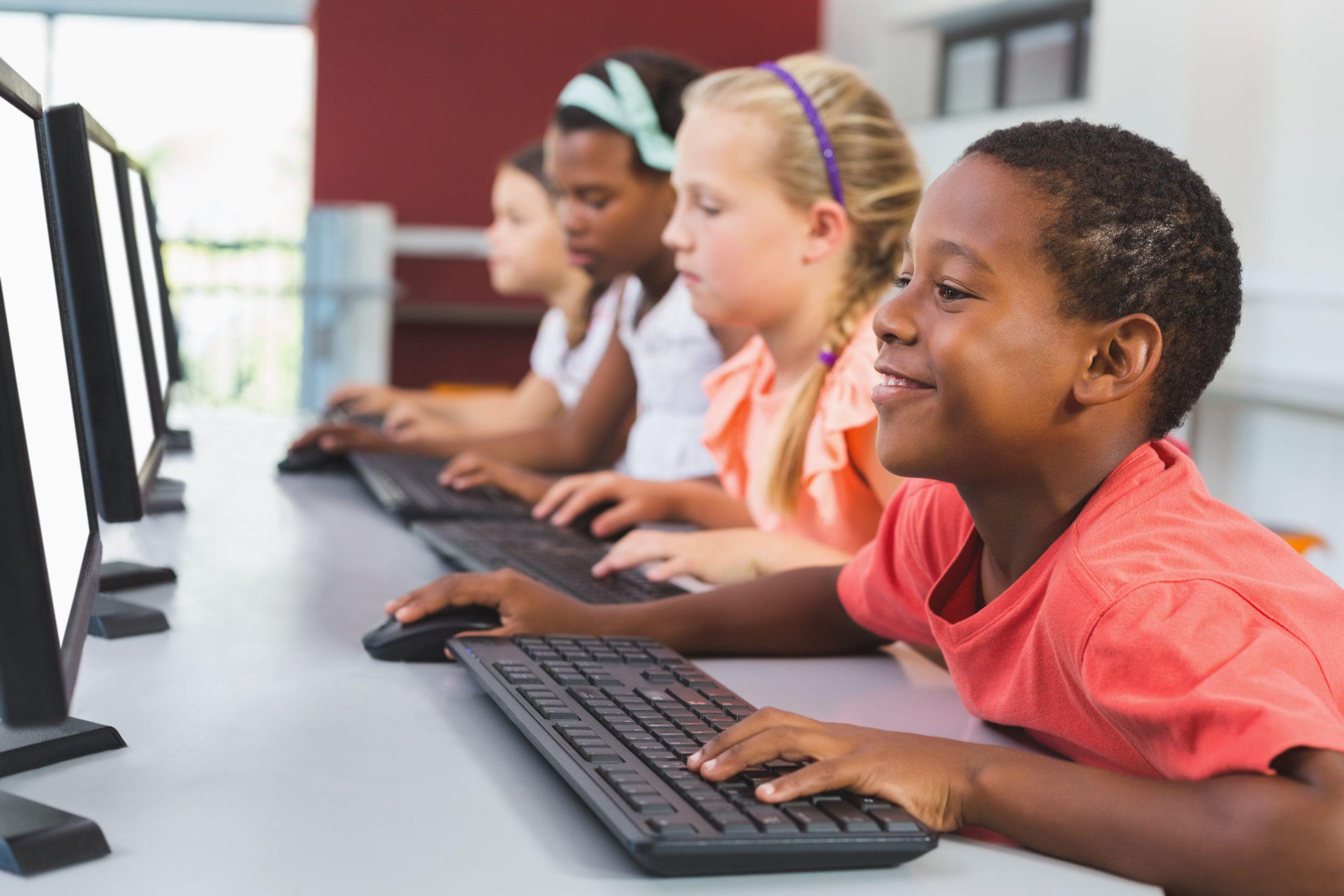 Children at computer shutterstock 575481121