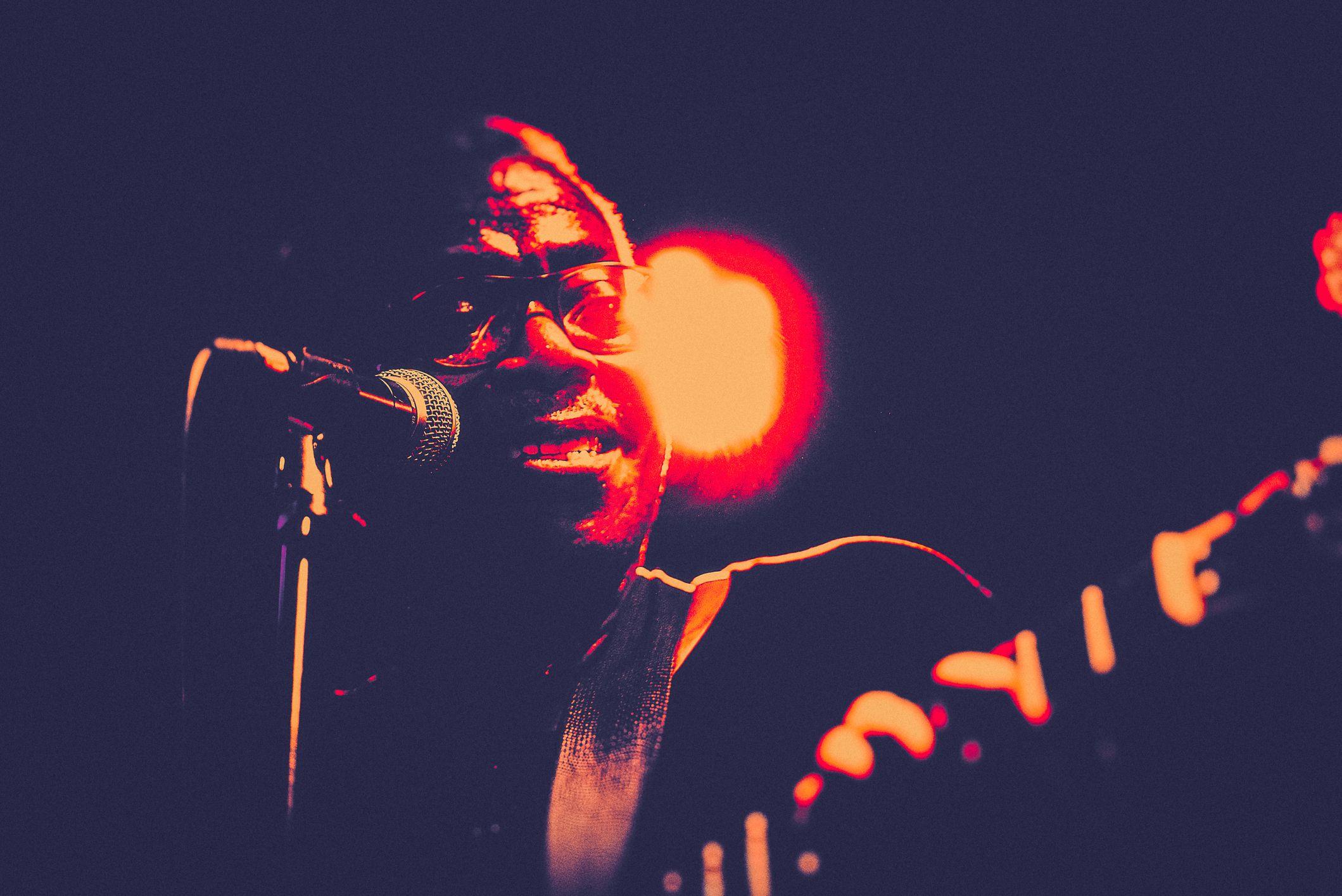 Man singing and playing guitar iStock 1198278415