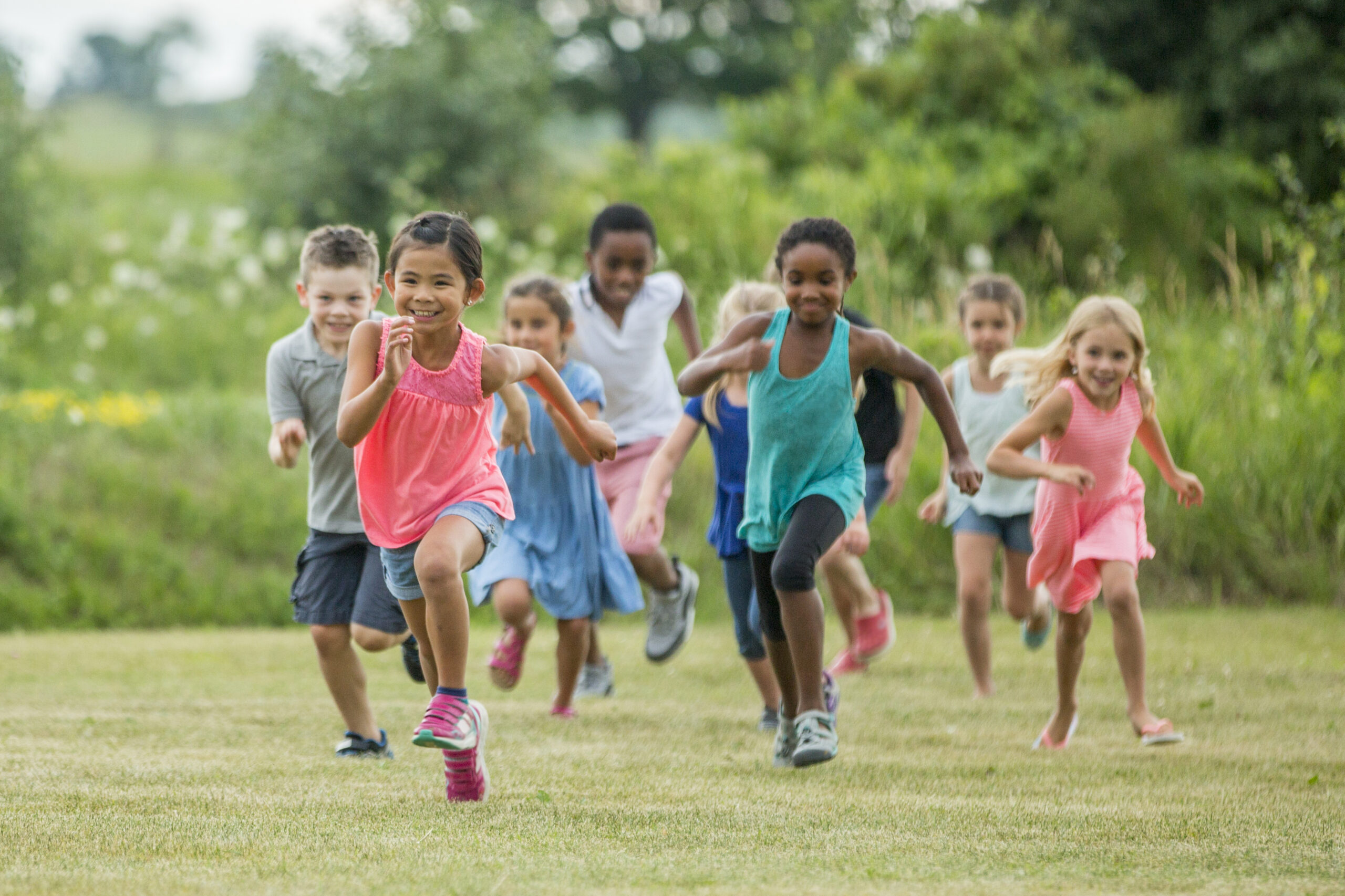 A group of children running at playtime.