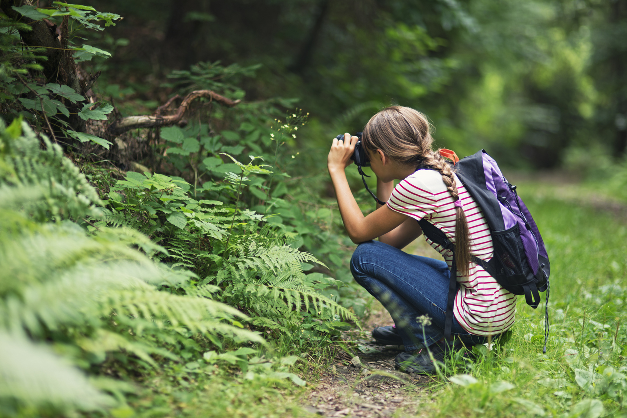 Young girl with a camera