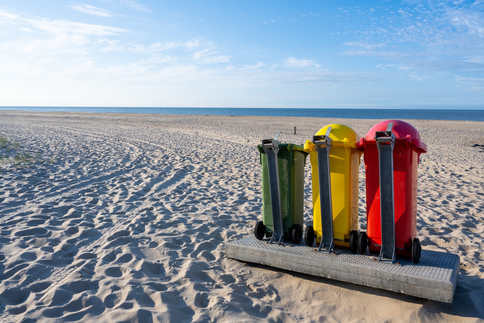 Recycling bins on a beach