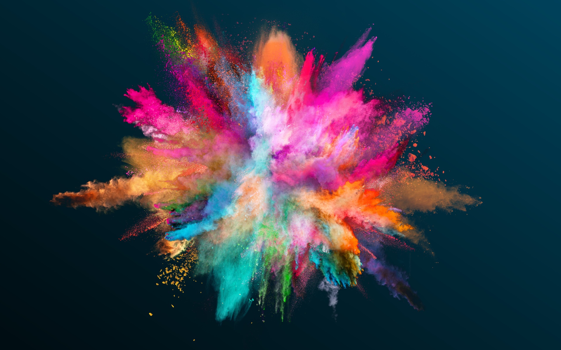 A vibrant explosion of colourful powders creating a burst of rainbow colours.