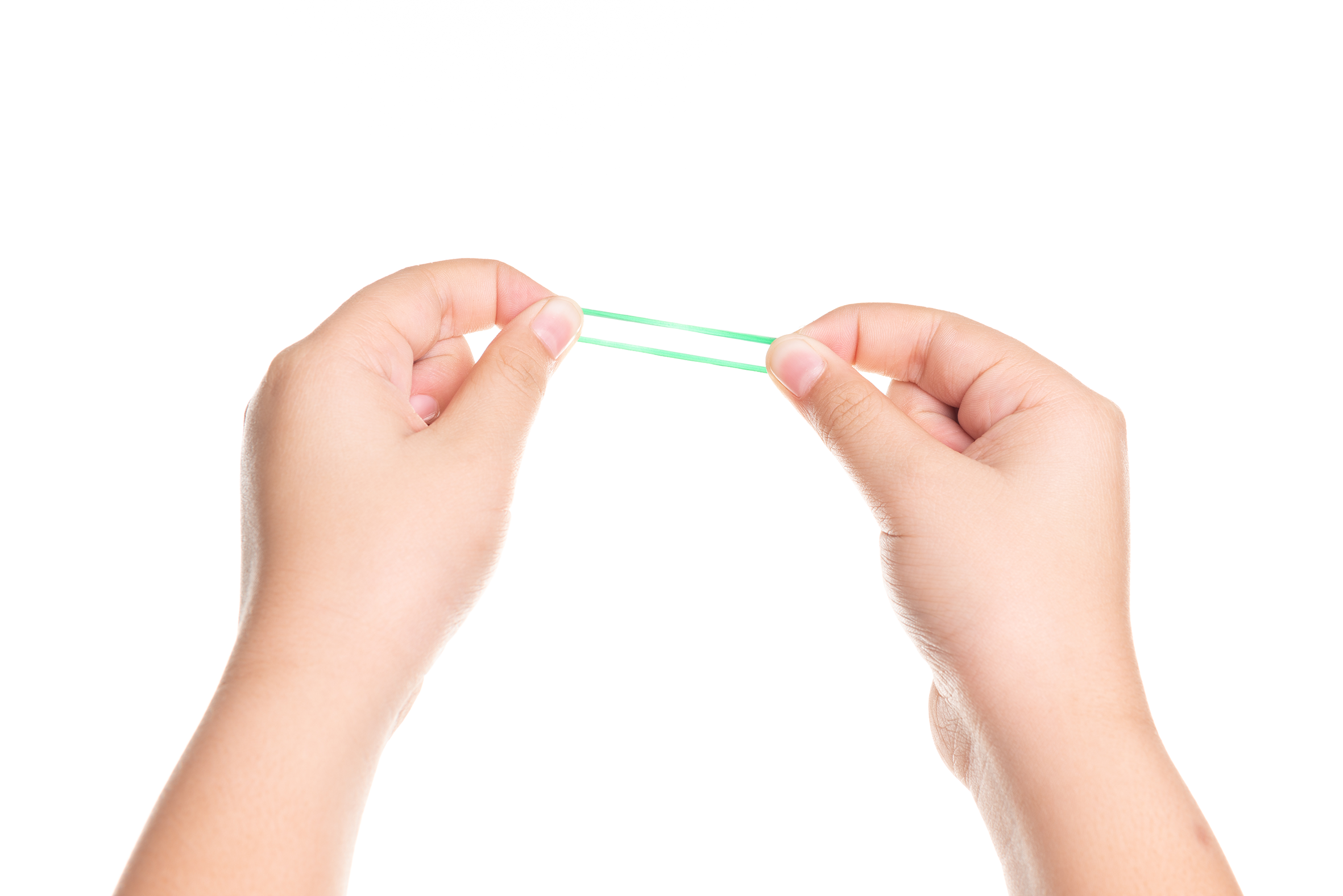 Hands stretching a green rubber band.