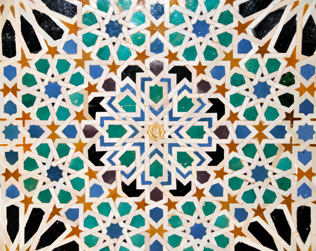 Intricate Islamic geometric tile design with stars and shapes in blue, green, black, and gold.