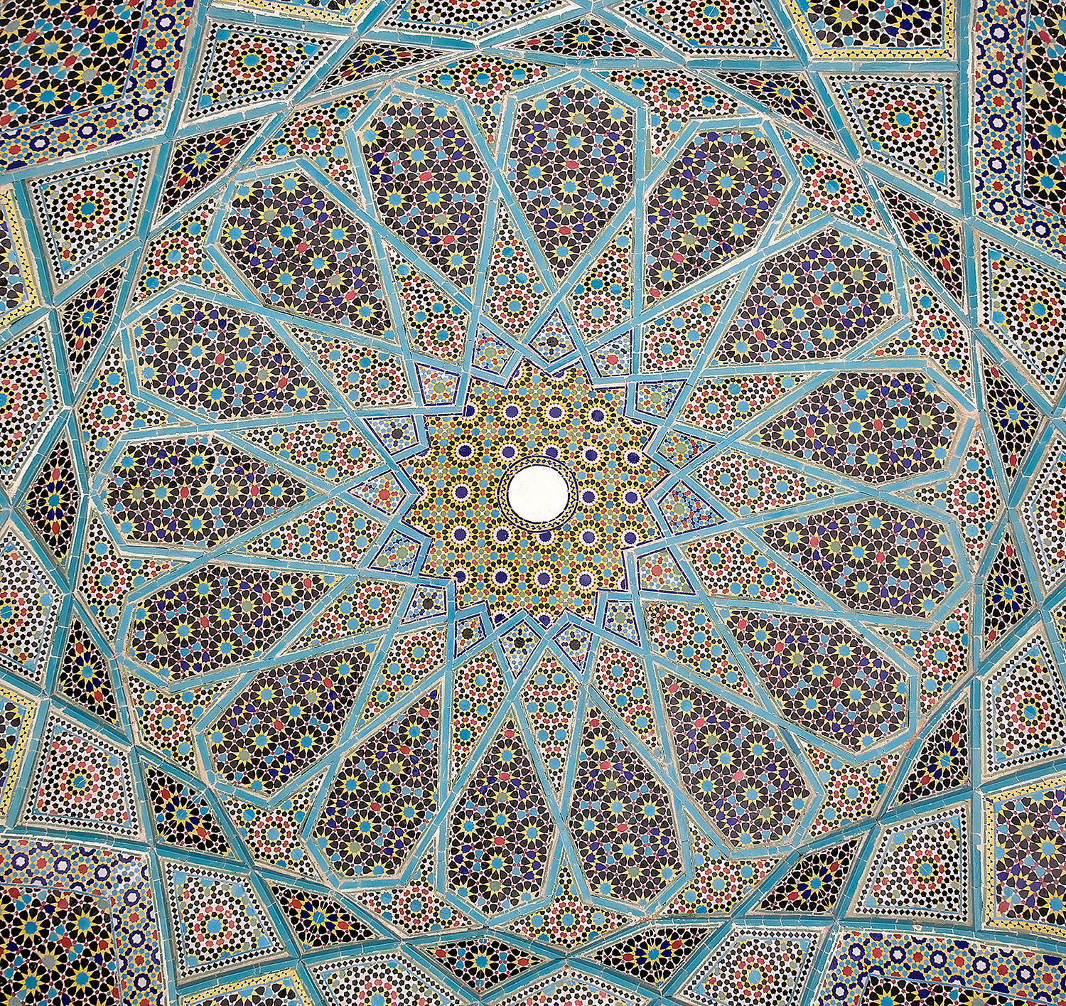 Islamic geometric dome pattern with intricate star and polygonal motifs in blue and gold