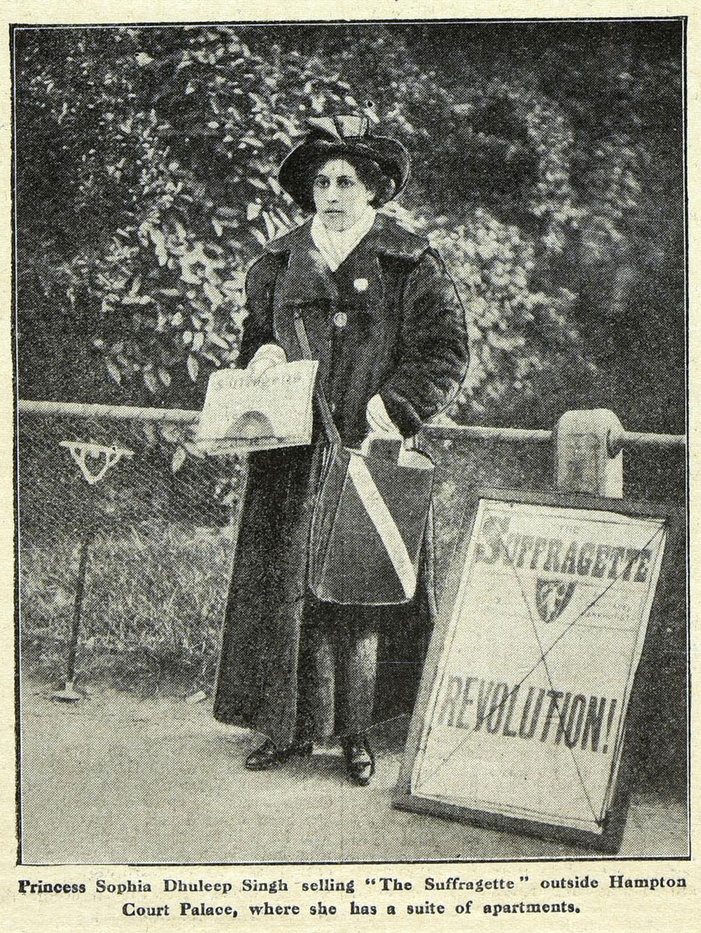 Black-and-white historical photograph of Princess Sophia Duleep Singh selling newspapers outside Hampton Court Palace.
