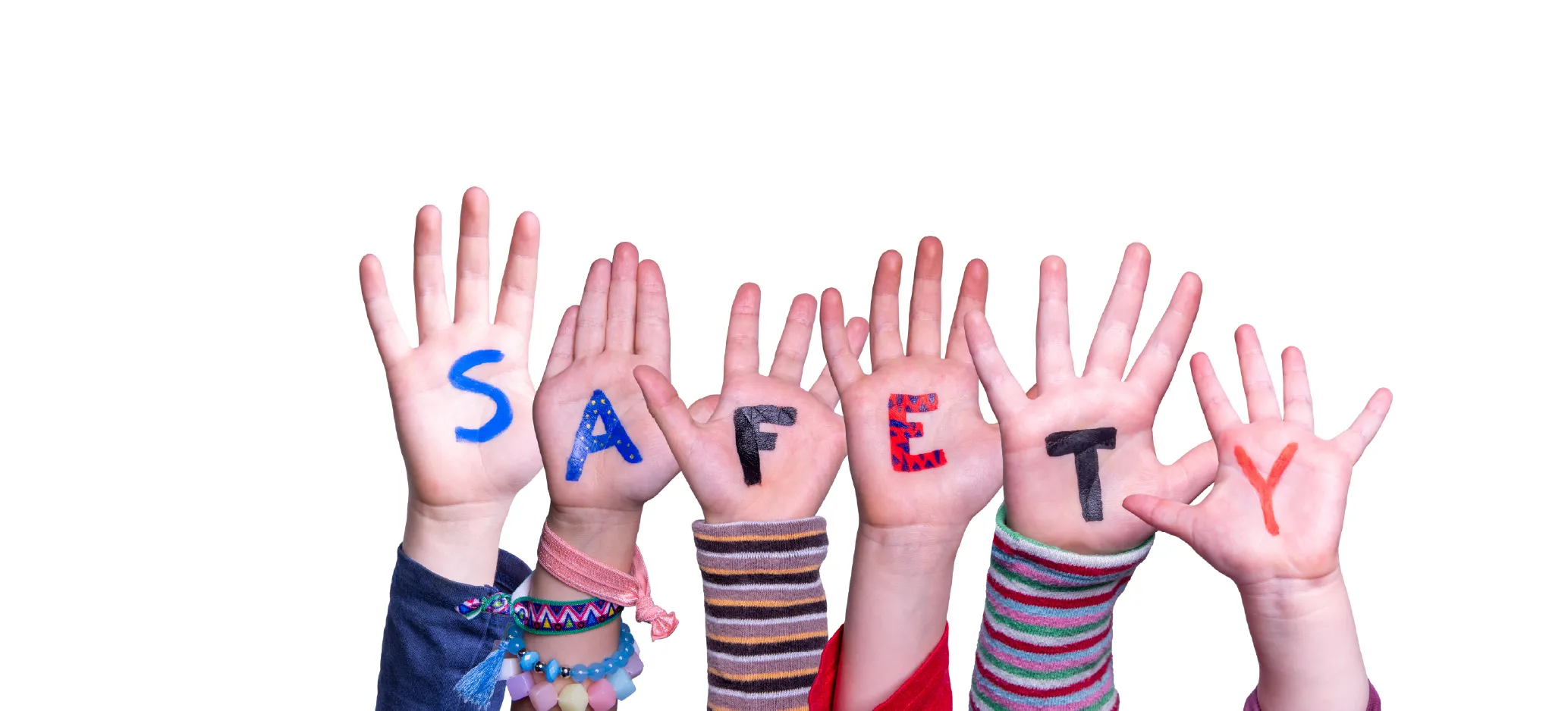 Children’s hands raised with the word safety written on them.