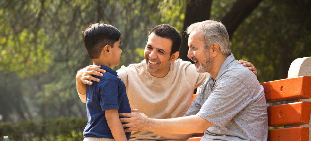 Photograph showing a father, grandfather and son of Asian heritage.