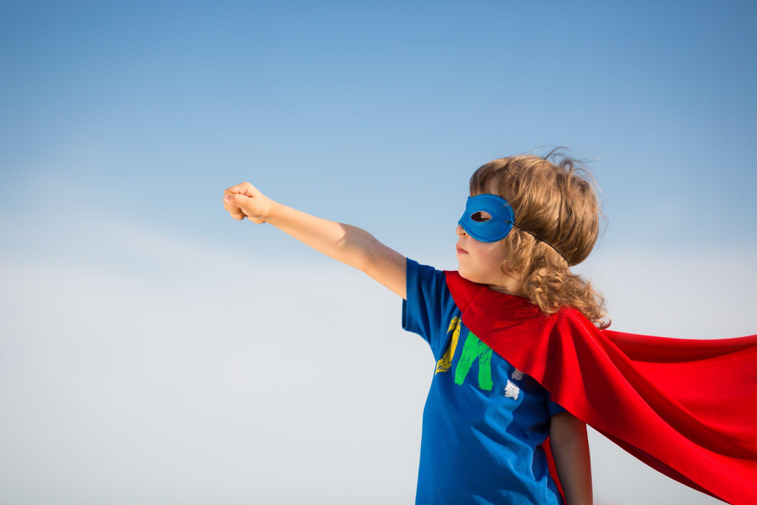 Child dressed as superhero shutterstock 144352681