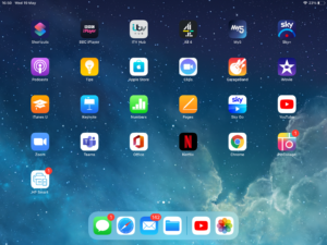 iPad tablet interface with the dock displayed at the bottom of the screen