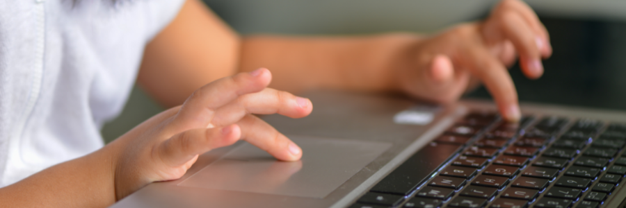 primary school pupil learning on a laptop
