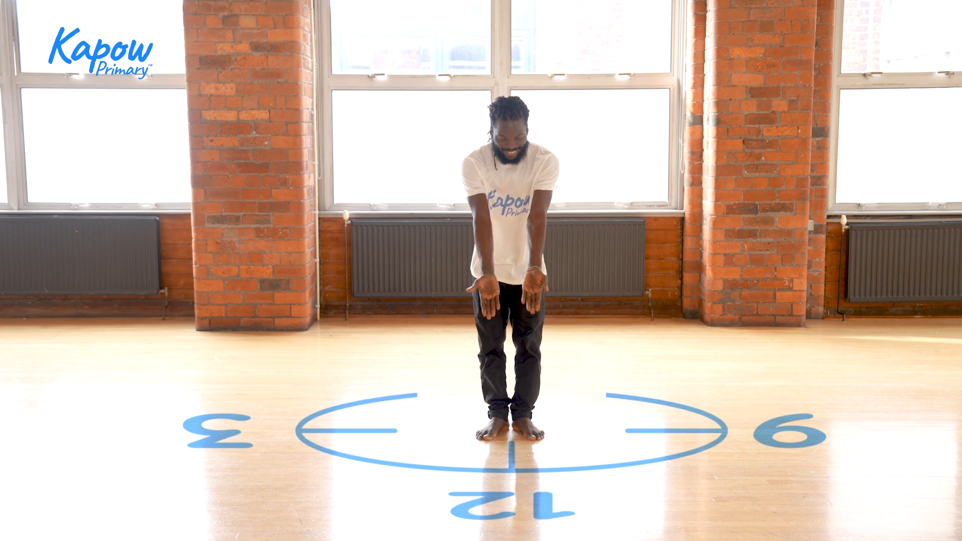 Teacher standing in circle showing beat count.