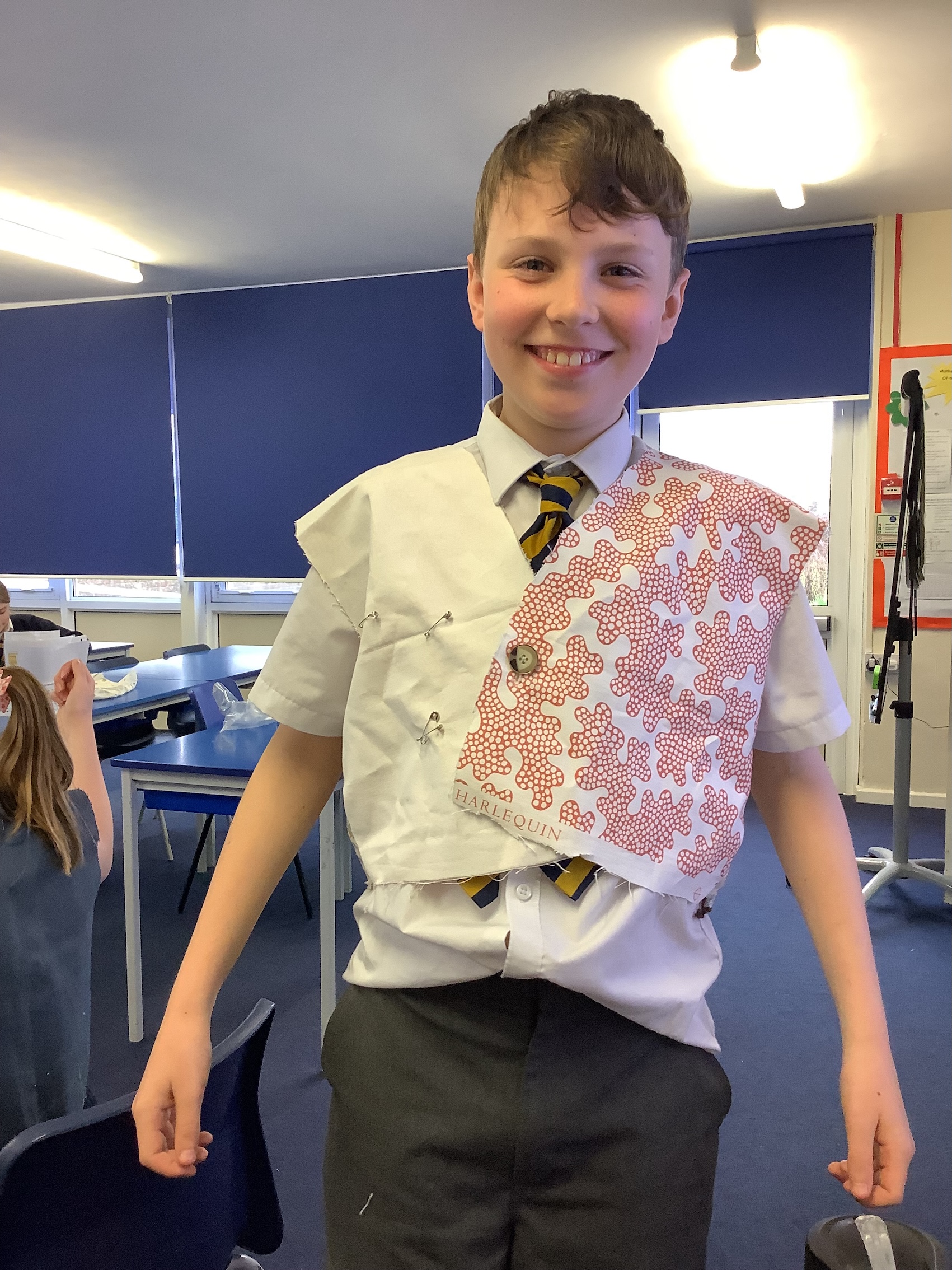 Year 6 child wearing a hand-sewn waistcoat.