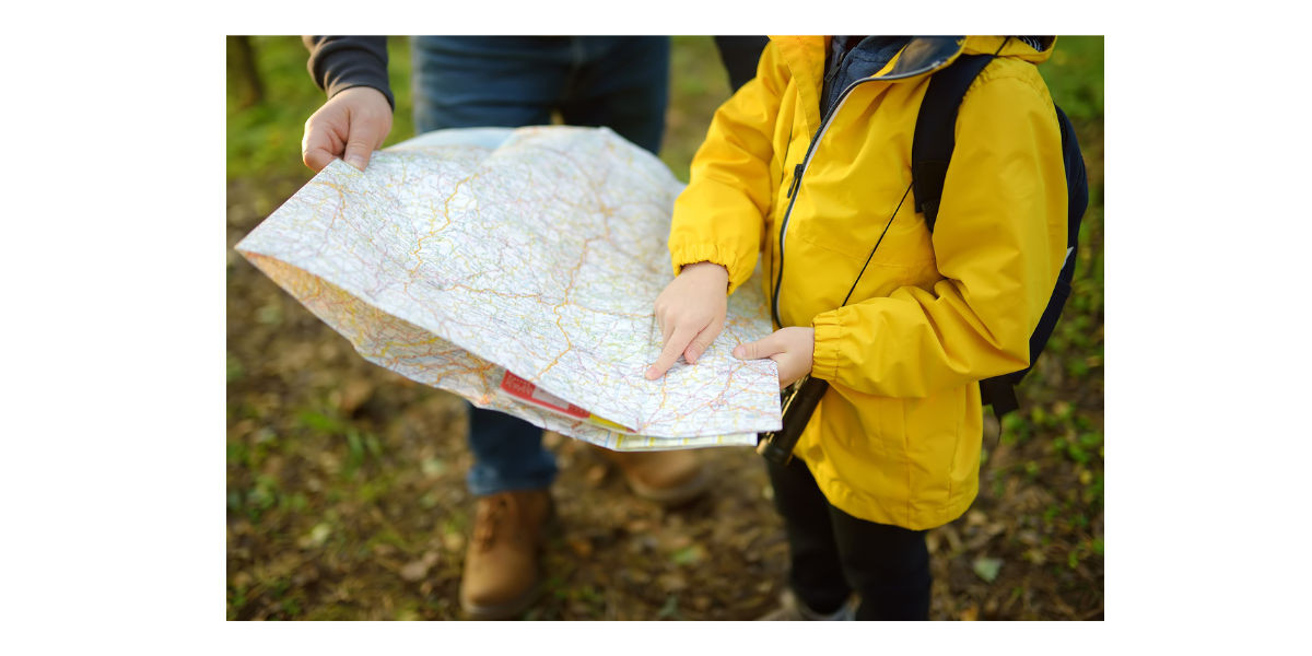 Child and adult looking at a map
