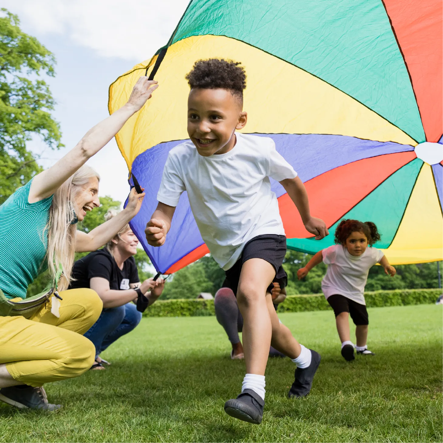 Children playing parachute games in PE.