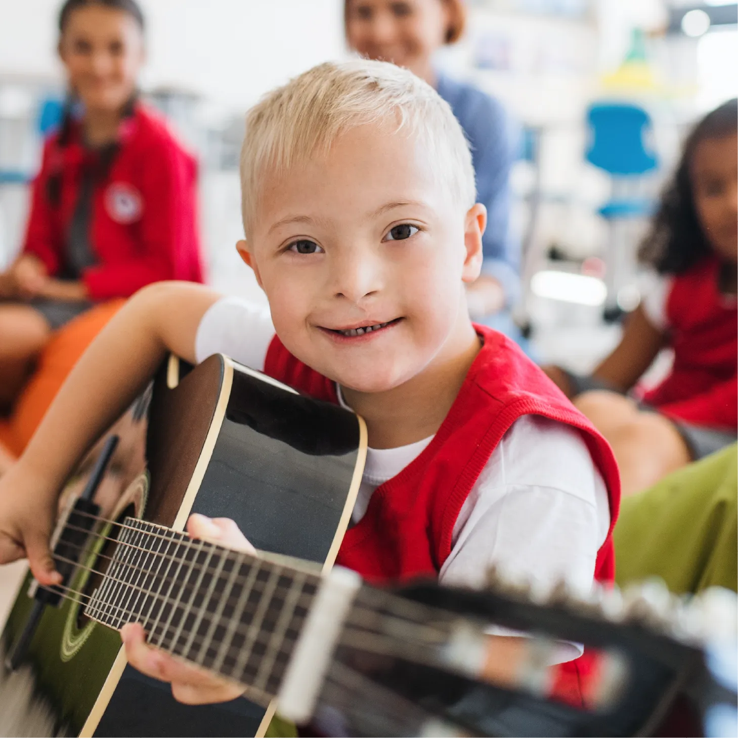 A child plays a guitar.