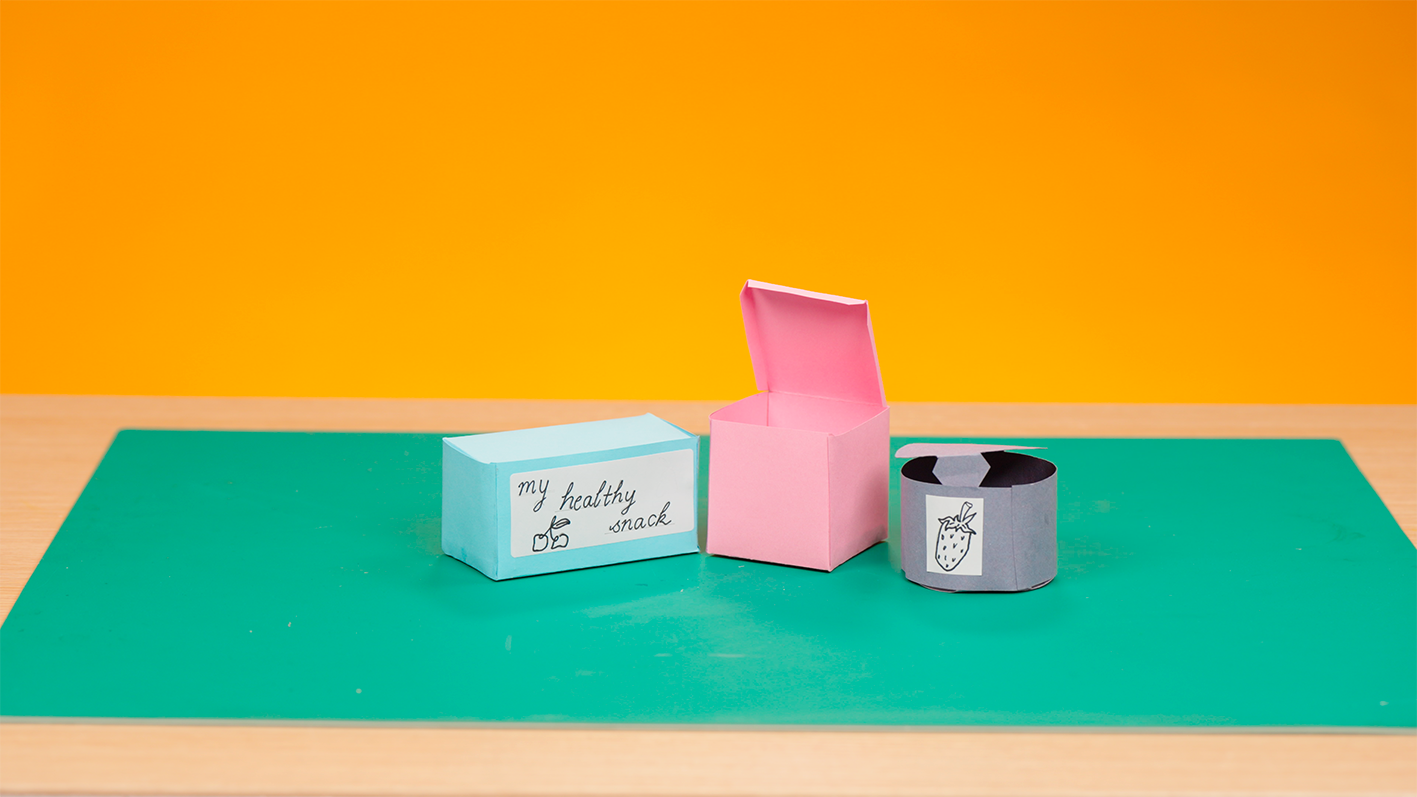 Three 3D nets made from card to hold healthy snacks