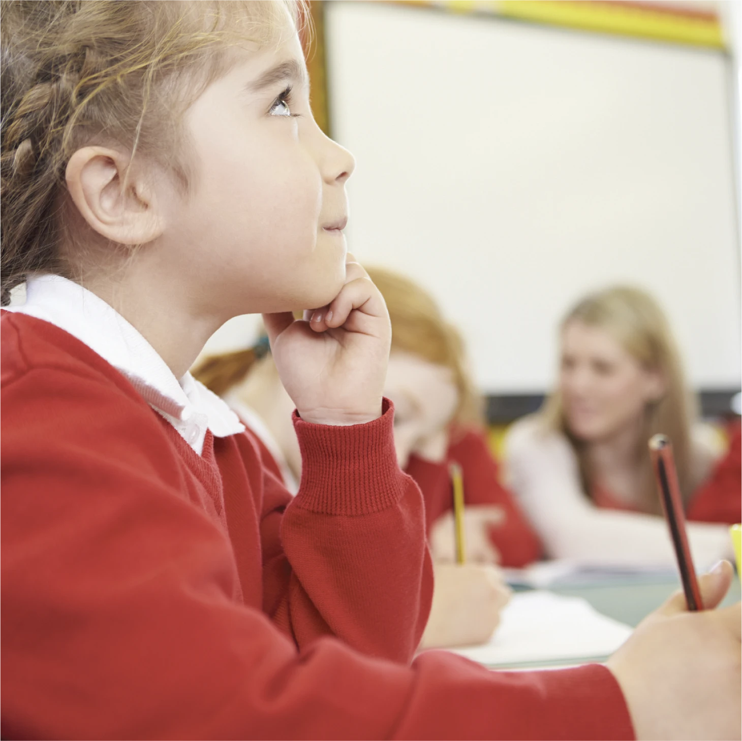 Child thinking with their hand on their chin