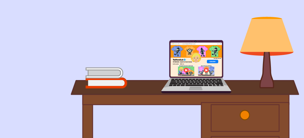 Laptop on a desk showing a video channel page, with books and a lamp.